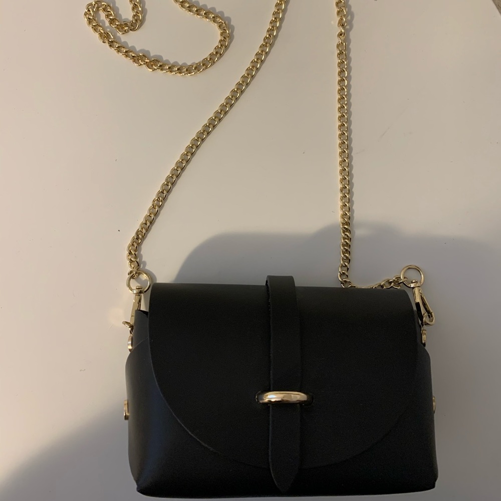 Black leather purse with gold chain